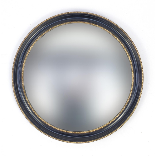 181 - Circular convex mirror with ebonised and gilt frame, 42cm in diameter