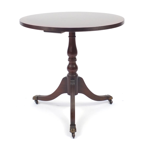 84 - Circular inlaid mahogany occasional table with brass paw feet, 60cm high x 61cm in diameter