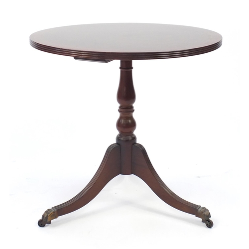 84 - Circular inlaid mahogany occasional table with brass paw feet, 60cm high x 61cm in diameter