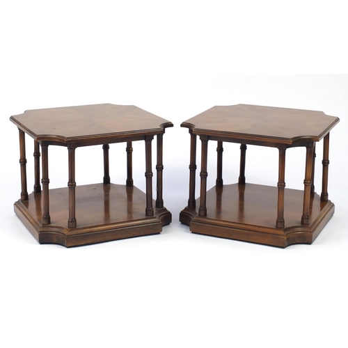65 - Pair of mahogany occasional tables, each with quarter veneered top on turned column platform base, 4... 
