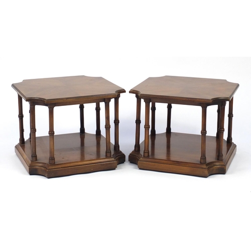 65 - Pair of mahogany occasional tables, each with quarter veneered top on turned column platform base, 4... 