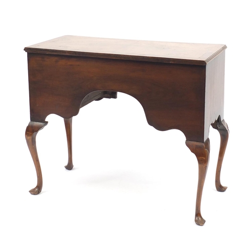2051 - Walnut and mahogany cross banded low boy, fitted with four drawers on shell carved cabriole legs, 80... 