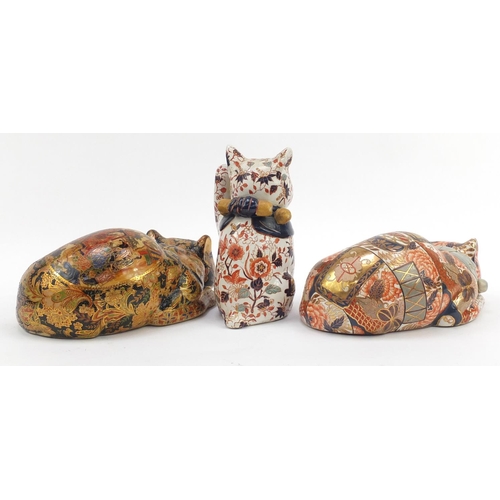 169 - Three Chinese hand painted pottery cats, the largest 32cm in length