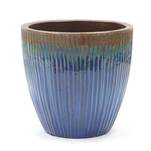 2074 - Large circular planter with reeded decoration and dripping glaze in blue and brown, 49cm high x 52cm... 