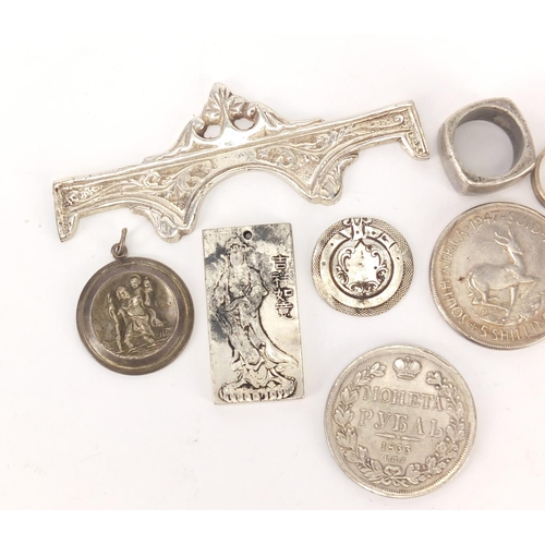 397 - Silver and white metal objects including a Chinese pendant, St Christopher pendant and rings