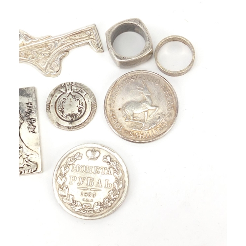 397 - Silver and white metal objects including a Chinese pendant, St Christopher pendant and rings