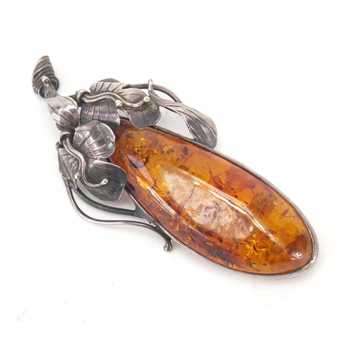 319 - Large silver and natural amber brooch, 7cm in length