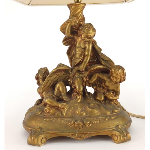 174 - Gilt putti table lamp, 43cm high