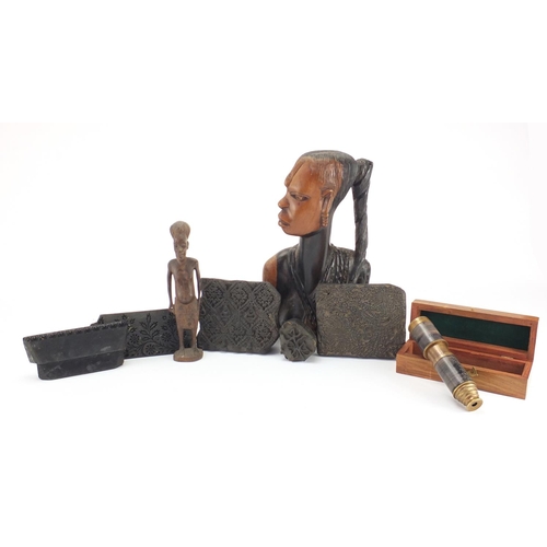 570 - Wooden items including African busts, printing blocks and a telescope