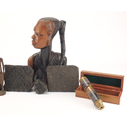 570 - Wooden items including African busts, printing blocks and a telescope