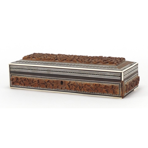 201 - Vizagapatam glove box carved with leaves and berries, 30cm wide