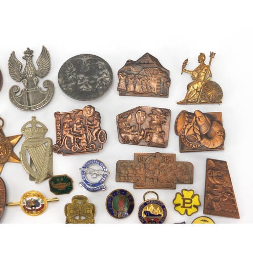 670 - Vintage and later Militaria and badges including two British Military stars, a Queen's Own Royal Wes... 