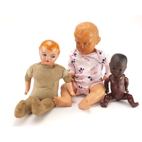 295 - Armand Marseille black bisque head doll and two others, the largest 52cm high
