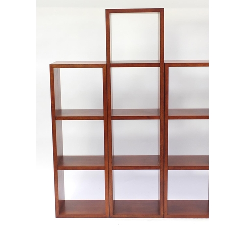 57 - Two pairs of mahogany wall pocket shelves, the largest 165cm H x 43.5cm W x 31cm D