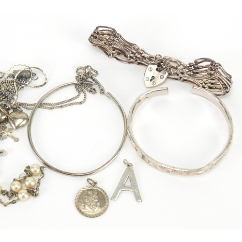 348 - Silver and white metal jewellery including a gate bracelet and pendants, approximate weight 61.0g