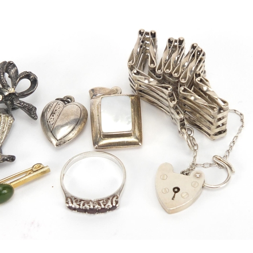 303 - Silver jewellery including two gate bracelets, two pendants and a bouquet brooch