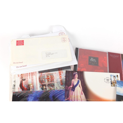 641 - Royal Mail presentation packs and a Queen Elizabeth Century five pound coin