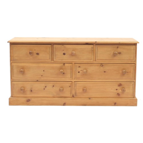 2052 - Pine seven drawer chest, 75cm H x 147cm W x 42cm D