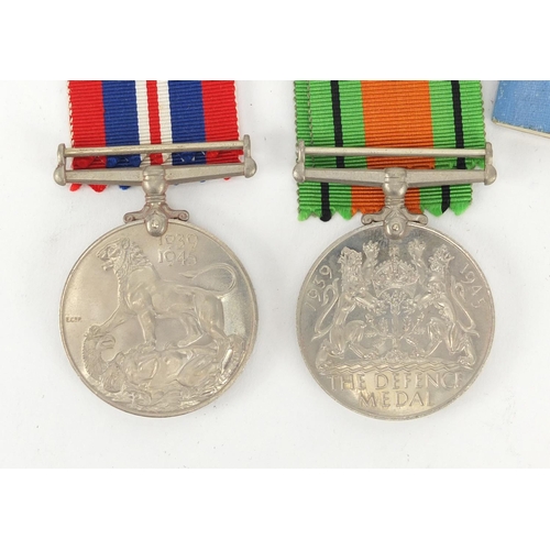 668 - Two British Military World War II medals with postage box and WAAF booklet