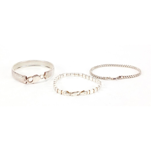 309 - Three silver bracelets, approximate weight  36.0g