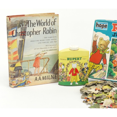 523 - Rupert the Bear talcum powder, jigsaw puzzle and The World of Christopher Robin by A A Milnee