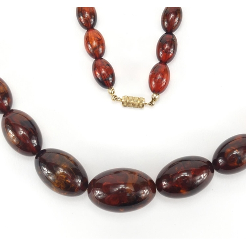 304 - Amber coloured bead necklace, 72cm in length, approximate weight 64.0g
