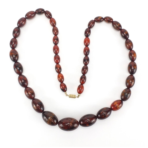 304 - Amber coloured bead necklace, 72cm in length, approximate weight 64.0g