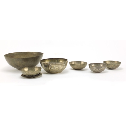 404 - Six Middle Eastern silver coloured metal bowls and an ashtray, the largest 21.5cm in diameter