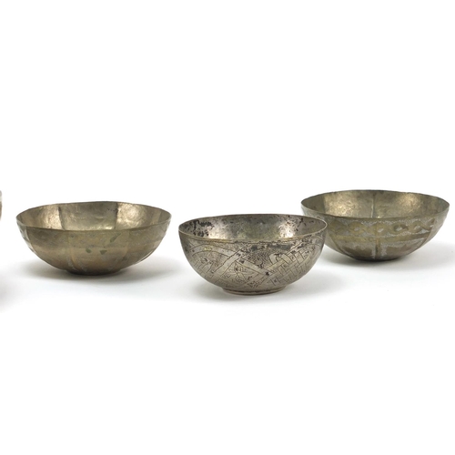 404 - Six Middle Eastern silver coloured metal bowls and an ashtray, the largest 21.5cm in diameter