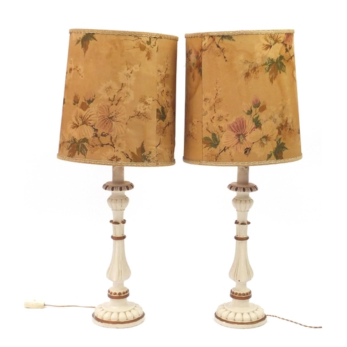 234 - Pair of cream and gilt painted wood table lamps with shades, 89cm high