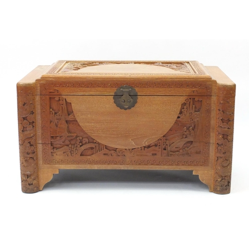 2 - Chinese camphor wood trunk carved with figures, junks and dragons, 58cm H x 100cm W x 50cm D
