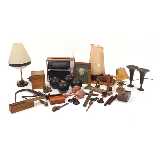 619 - Wooden and metalwares including vintage radio, bowls, leather whip, table lamp and pair of Cairo War... 