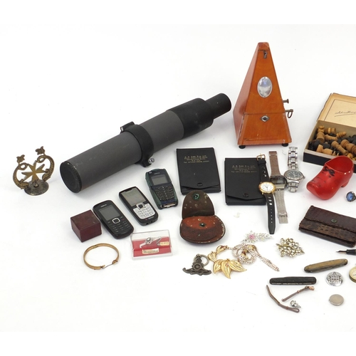 423 - Objects including a metronome, wristwatches, costume jewellery and a spotting scope