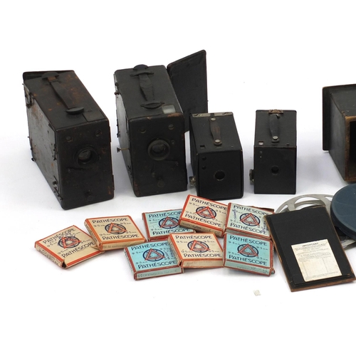 605 - Vintage cameras, film reels and accessories including Kodak Brownie's and Pathescope