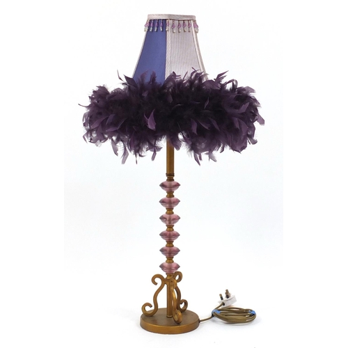179 - Gilt metal and purple plastic table lamp with feather shade, overall 86cm high