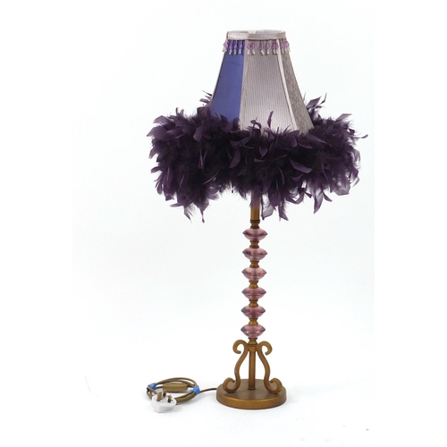 179 - Gilt metal and purple plastic table lamp with feather shade, overall 86cm high