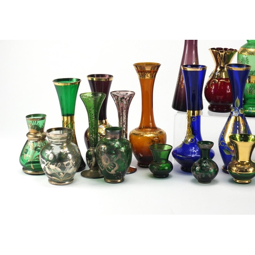 257 - Colourful glass vases, some with silver overlay and hand painted with flowers, the largest 21cm high