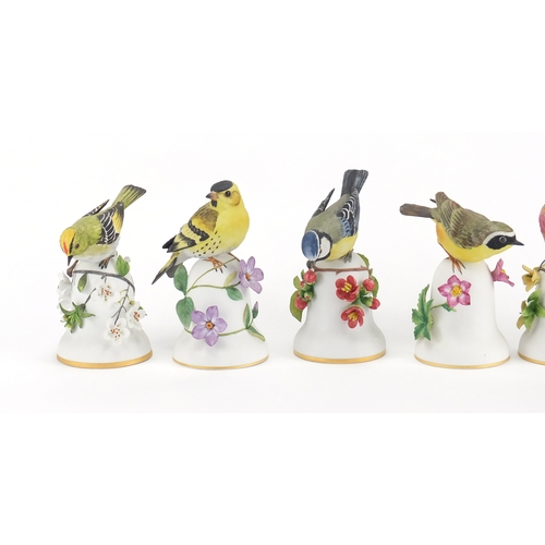 225 - Six Franklin Mint bird table bells including The Nuthatch, The Yellow Throat and The Linnet, the lar... 