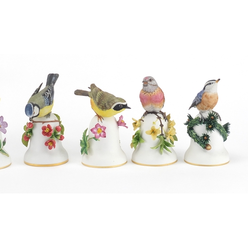 225 - Six Franklin Mint bird table bells including The Nuthatch, The Yellow Throat and The Linnet, the lar... 