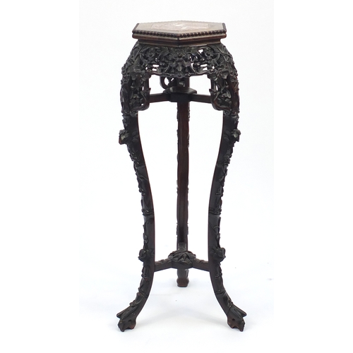 11 - Chinese hexagonal carved hardwood plant stand with inset marble top, 91cm high