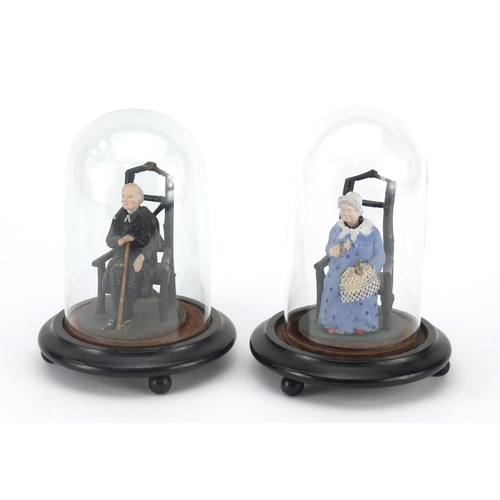560 - Pair of Victorian bisque nodding figures of elderly lady and gentleman, each with glass domse and eb... 