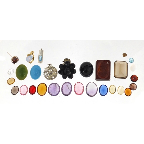 327 - Loose semi precious stones including an intaglio seal, smoky quartz amethyst and citrine