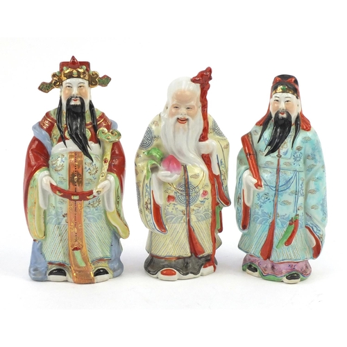 238 - Three hand painted Chinese porcelain figures of elders, the largest 22.5cm high