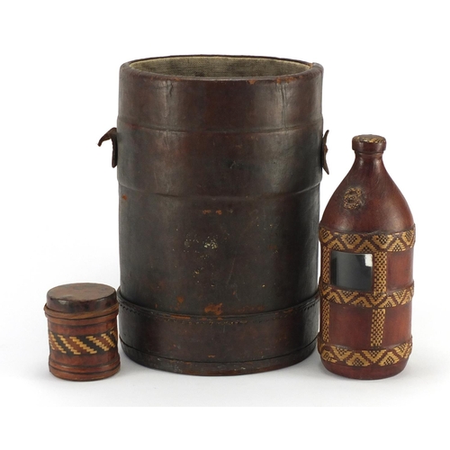 568 - Military interest leather bucket together with a tribal flask and container, the bucket 30cm high