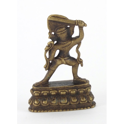 402 - Tibetan Patinated bronze figure, 7cm high