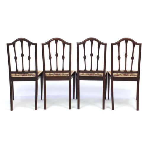 68 - Set of six Edwardian inlaid mahogany dining chairs including a carver, with floral upholstered seats... 