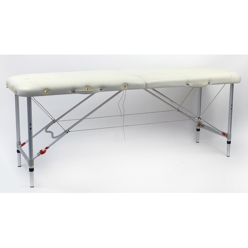 110 - Cream leather folding massage table