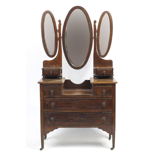 40 - Oak dressing table with triple aspect mirror above a series of six drawers, 172cm H x 92cm W x 46cm ... 