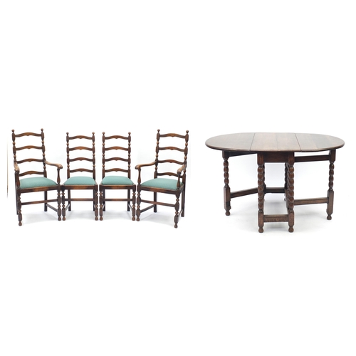 46 - Oak gate leg dining table with bobbin supports and set of four wavy ladder back chairs including two... 