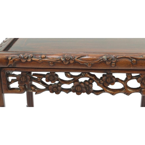 2005 - Chinese rosewood quartetto nest of occasional tables carved with flowers, the largest 72cm H x 50.5c... 